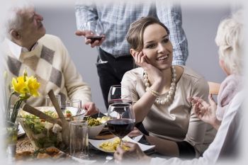 A family having conversation over dinner about planning the estate.